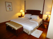 Bed at The Strand hotel in Yangon