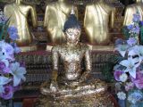 A Buddha image full of gold leat at Wat Pho