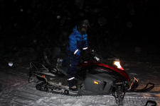 Nikki getting comfortable on the snowmobile