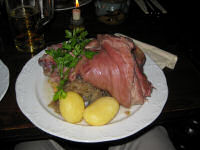 Tasting the local speciality: Eisbein or pork knuckle