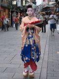 A beautiful Geisha in a street in Kyoto