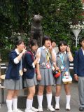 Japanese schoolgirls posing at Shibuya