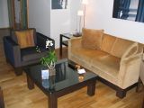 Sofa by the entrance to the room at Lebua