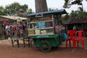 A stall selling stuff along the road to the airport